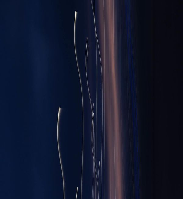 Abstract representation of energy flow with blue light streaks on a dark background.